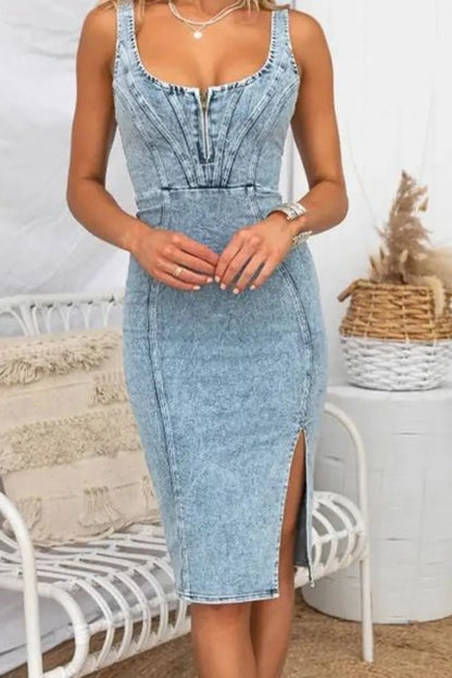 Front view of a denim dress with side slit, washed design and scoop neck, perfect for dressing up or down.