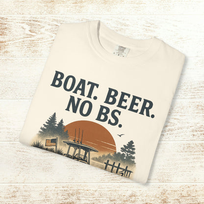 Boat Beer No BS Tee folded neatly on a wooden surface, featuring a classic design with a sunset backdrop.