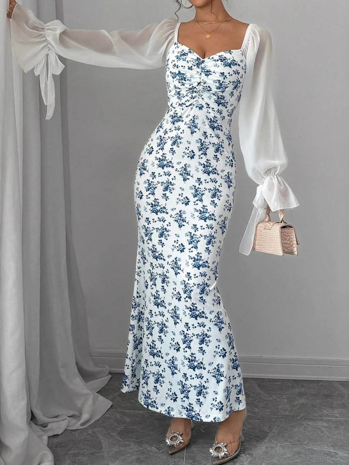 Floral Print Maxi Dress with Sweetheart Neckline and Ruffled Design - Showcasing a stunning floral print in white and blue, featuring a sweetheart neckline and elegant ruffled sleeves, perfect for any occasion.