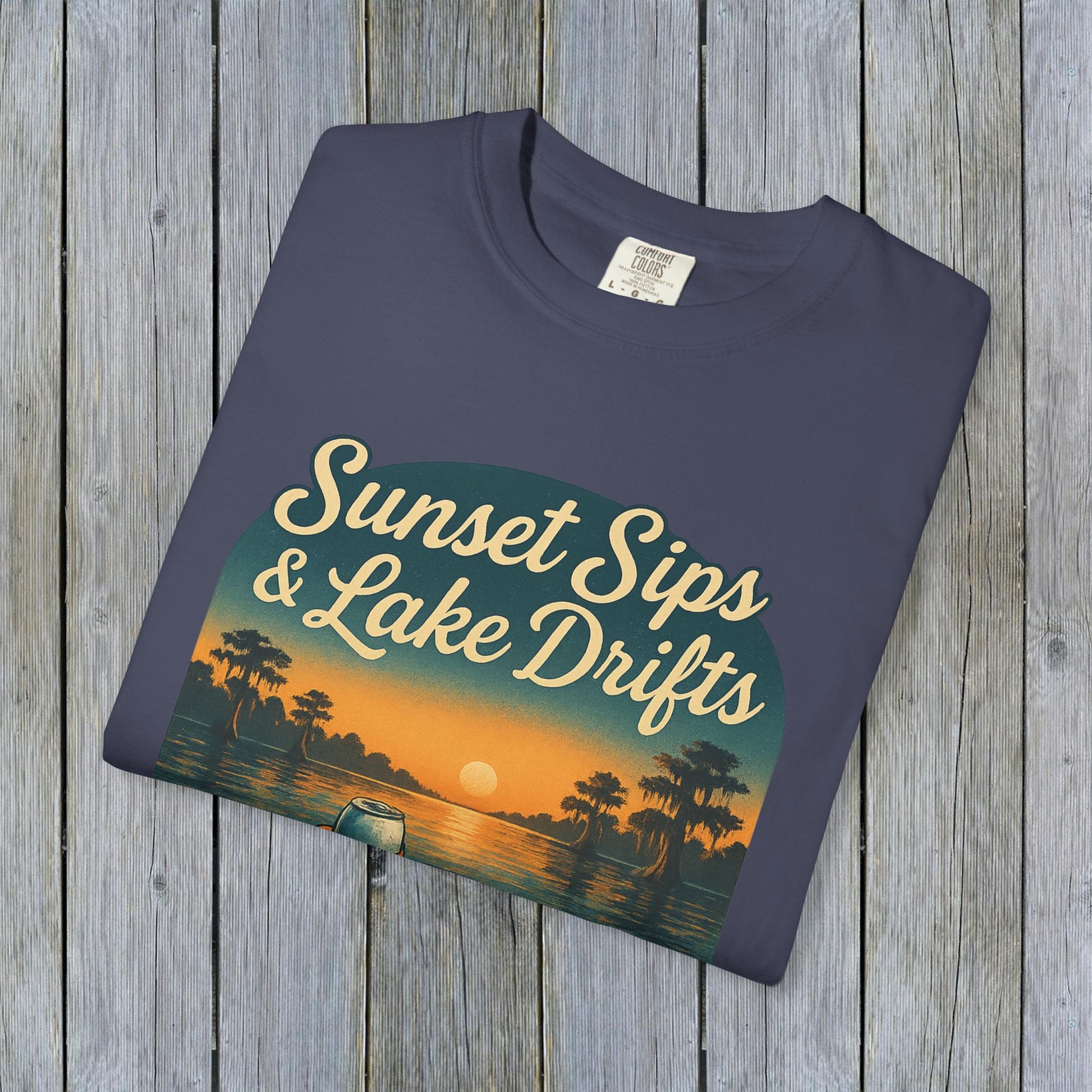 Lake Drifts T-Shirt in dark blue featuring 'Sunset Sips & Lake Drifts' graphic design, perfect for casual outdoor wear.