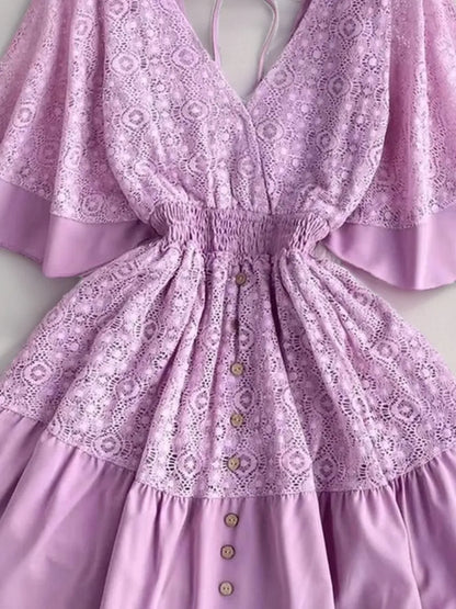 Detail shot of the Semi-Sheer Ruffle Hem Lace Mini Dress with Tie Back - Elegant Smocked Design in lavender, emphasizing lace patterns and buttons, perfect for stylish summer occasions.