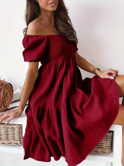 Full Size Ruffled Off-Shoulder Dress with Short Sleeves - Stretchy, Chic & Ruched Design in deep red, showcasing a model sitting elegantly.