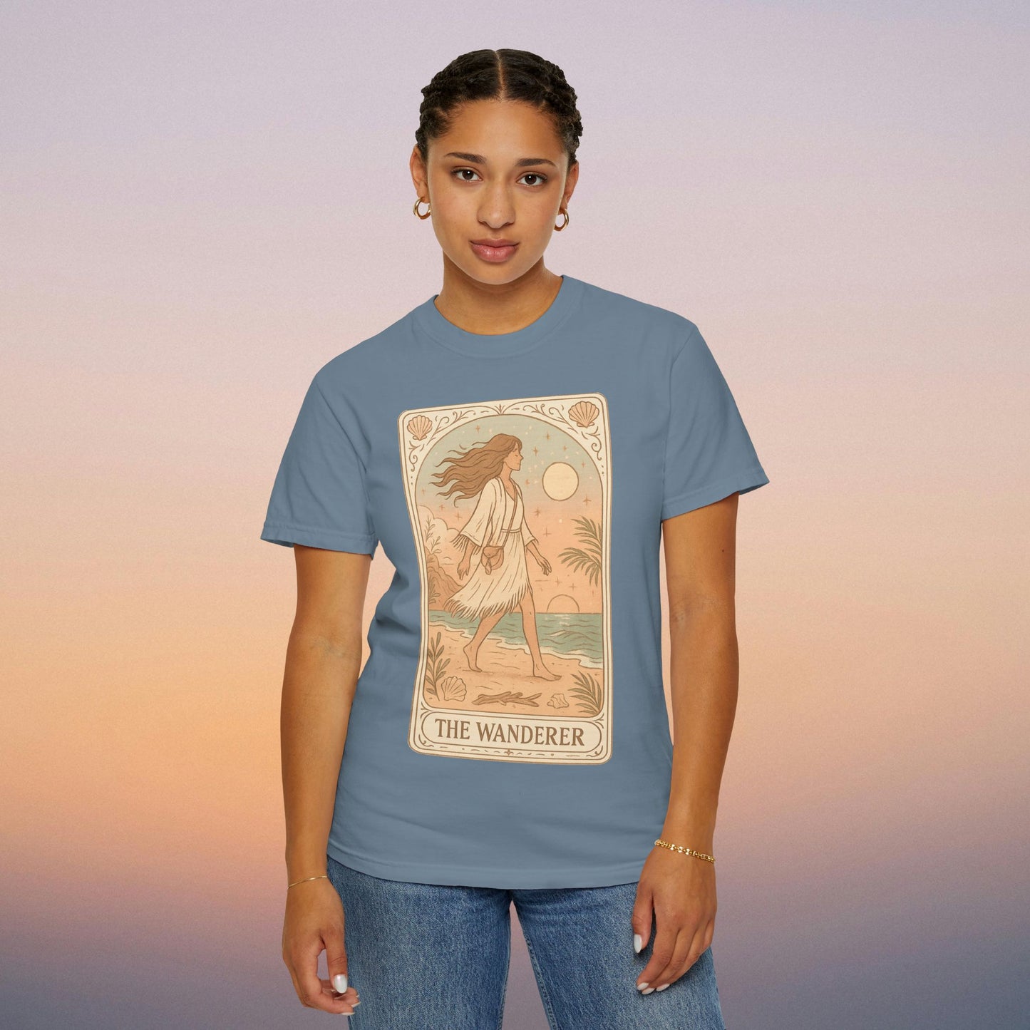 Wanderer Tarot Graphic Tee in soft blue, showcasing a charming design and comfort, ethically made with high-quality 100% cotton.