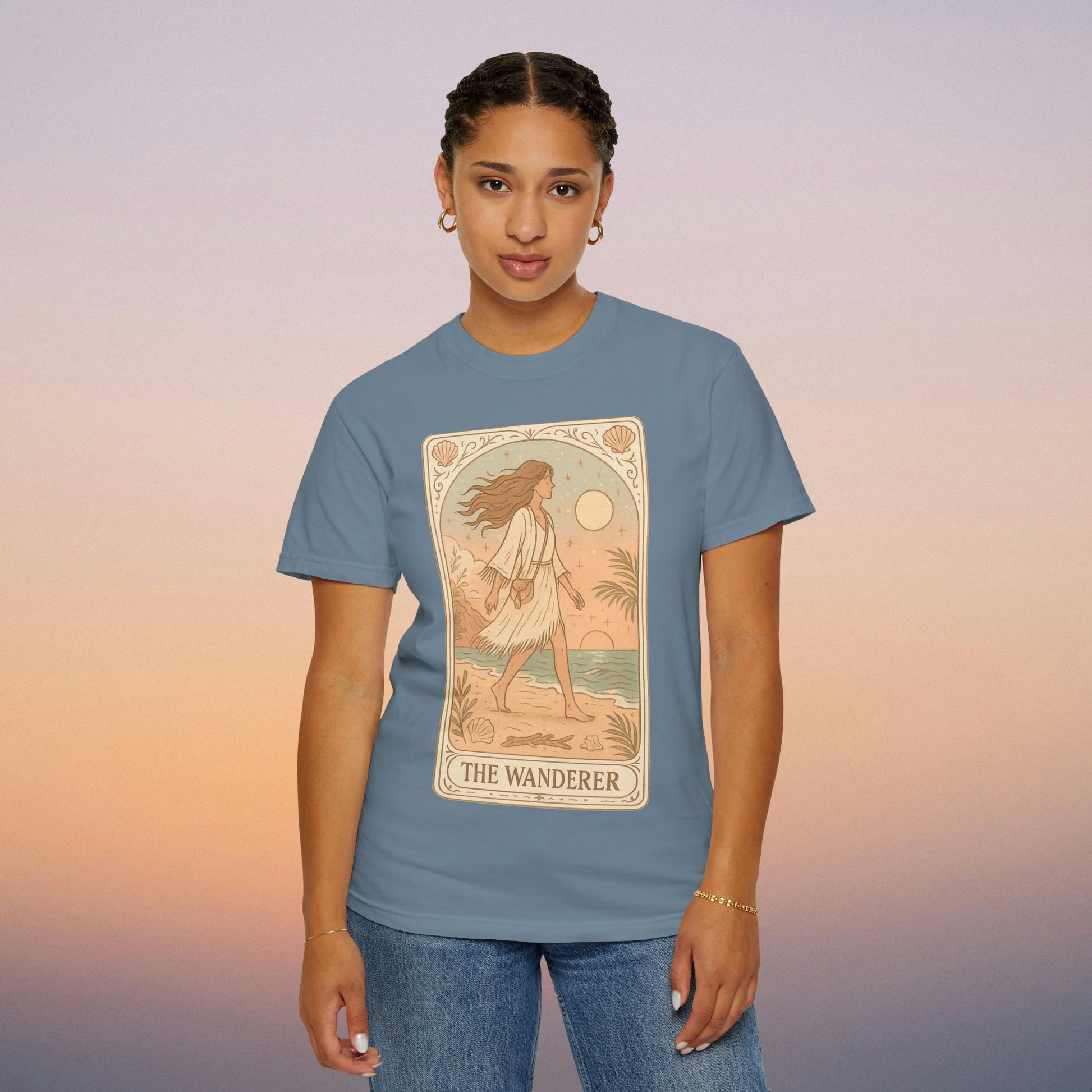 Wanderer Tarot Graphic Tee in soft blue, showcasing a charming design and comfort, ethically made with high-quality 100% cotton.