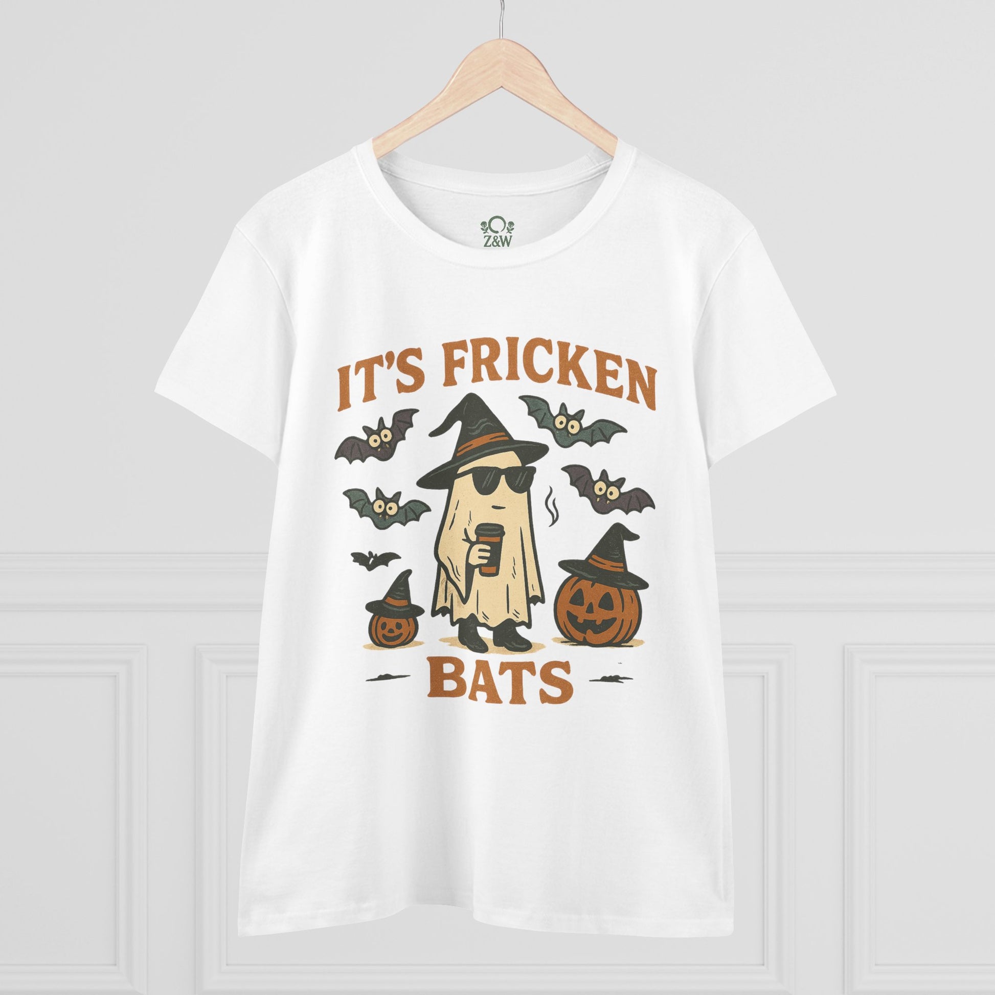 Fun Halloween unisex t-shirt featuring a graphic design of a ghost with sunglasses, bats, and pumpkins, perfect for trick-or-treating. Made from 100% cotton.