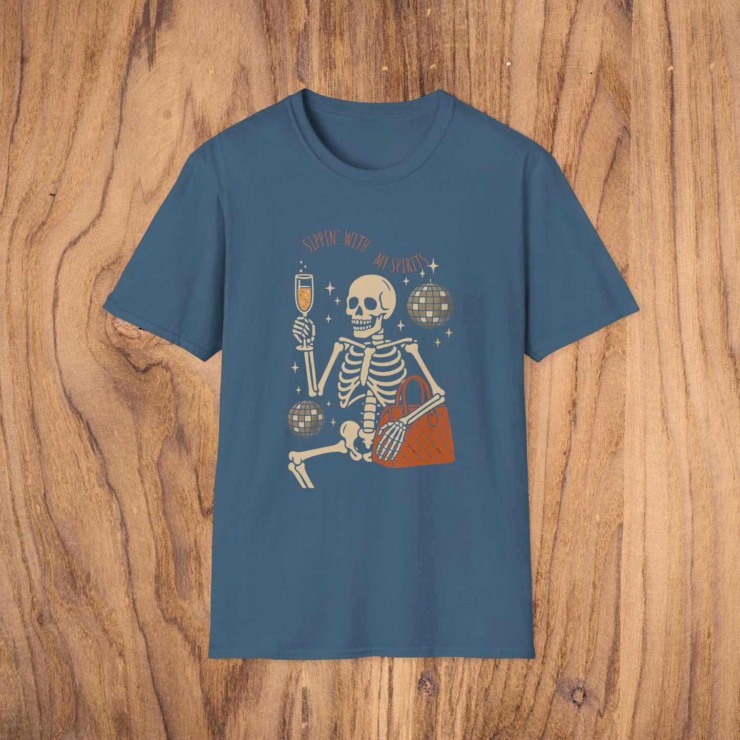 Spooky Spirits Graphic Tee featuring a cheerful skeleton holding a drink and disco ball, perfect for Halloween celebrations.