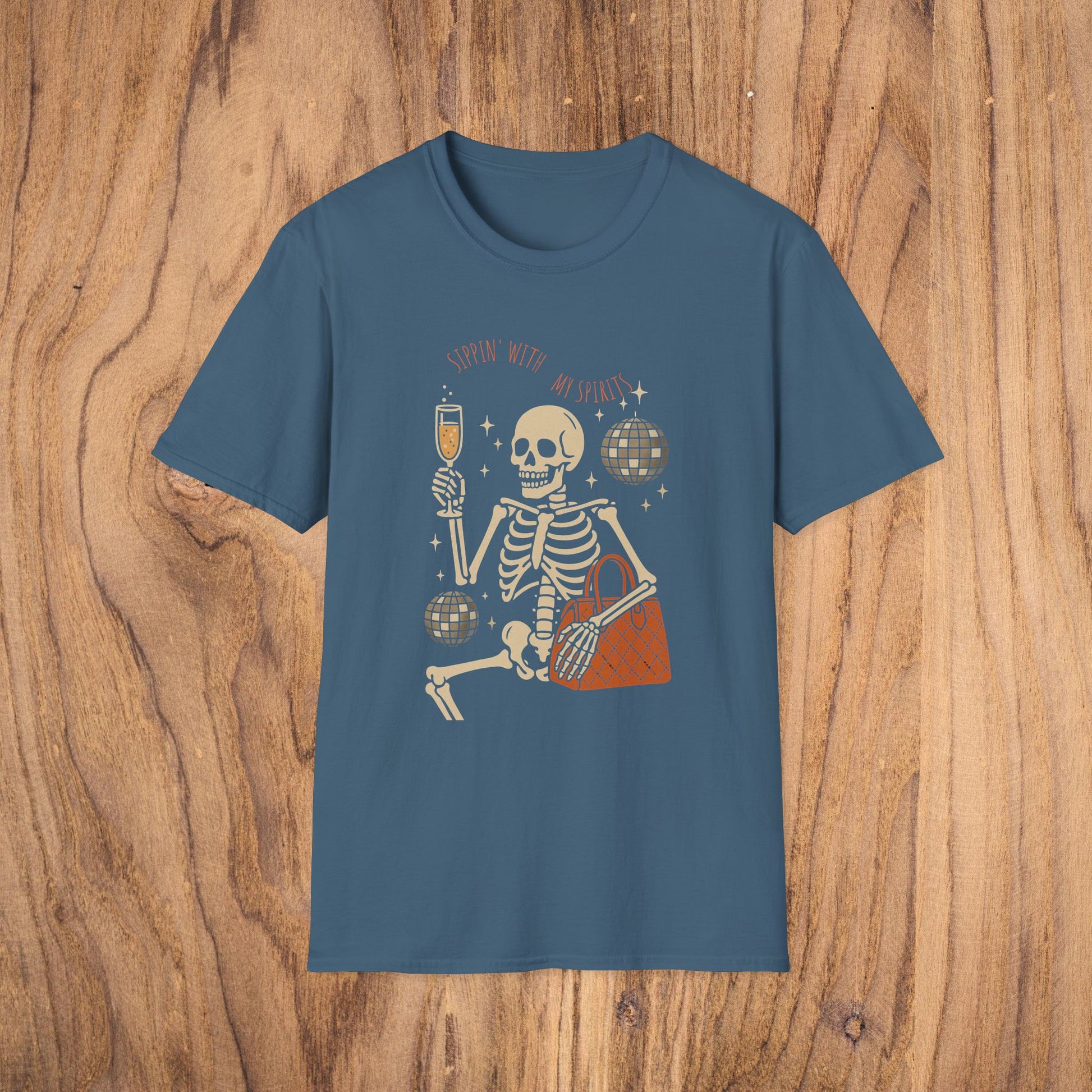 Spooky Spirits Graphic Tee featuring a cheerful skeleton holding a drink and disco ball, perfect for Halloween celebrations.