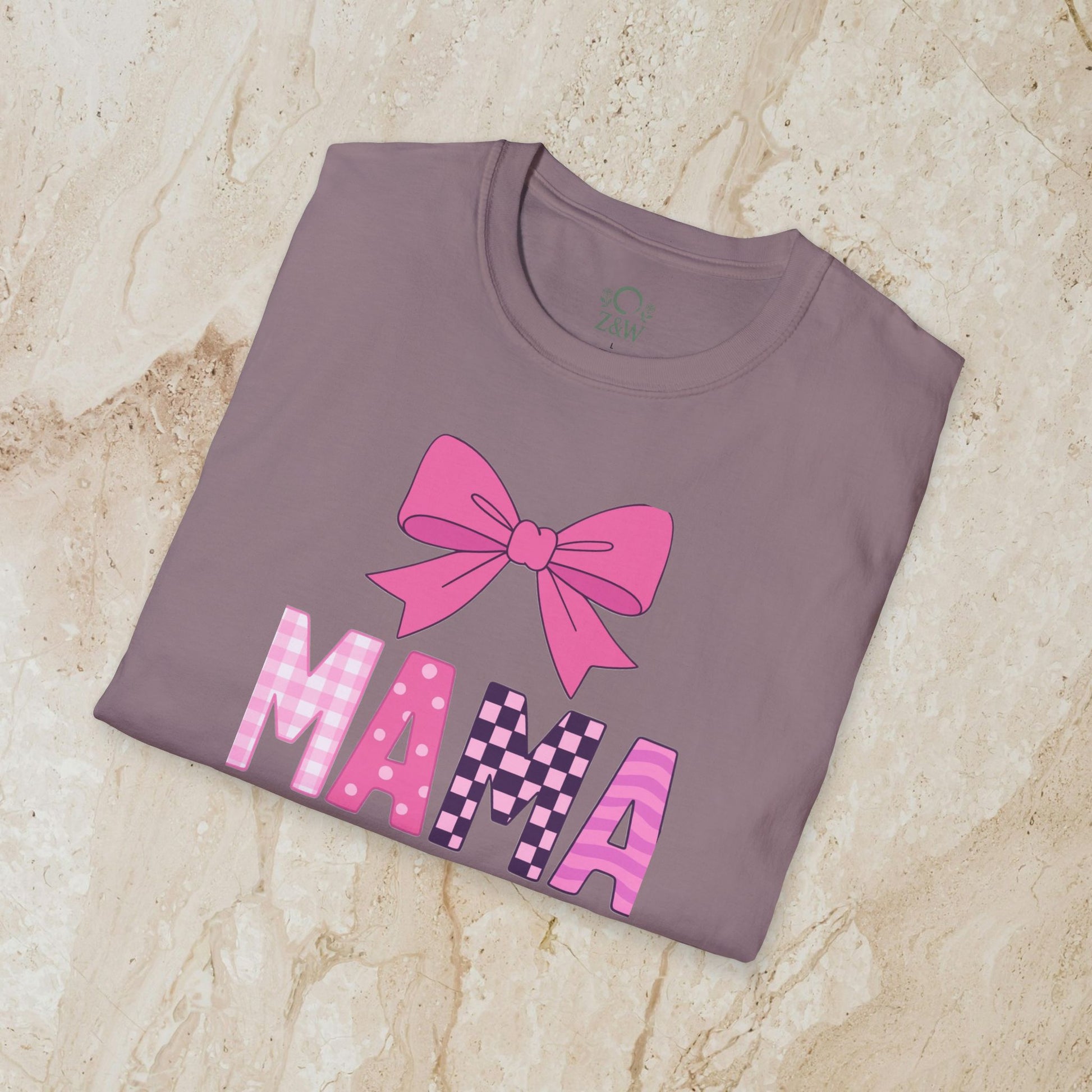 Mama Bow Tee in a stylish brown shade, featuring a pink bow graphic and vibrant 'MAMA' lettering, crafted from seamless 100% cotton for durability and comfort.