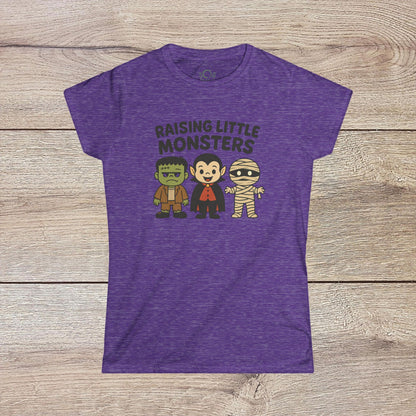 Purple Halloween Family T-Shirt showcasing playful characters of Frankenstein, a vampire, and a mummy, great for kids' Halloween celebrations - Raising Little Monsters Cute Kids Tee.