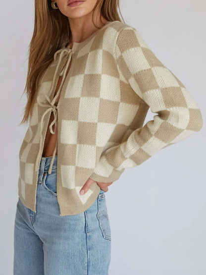 Close-up of the Checkered Tie-Front Cropped Cardigan for Women, showcasing the chic tie-front detail and comfortable fit in a beautiful cream and beige checkered design, crafted from slightly stretchy 100% polyester.