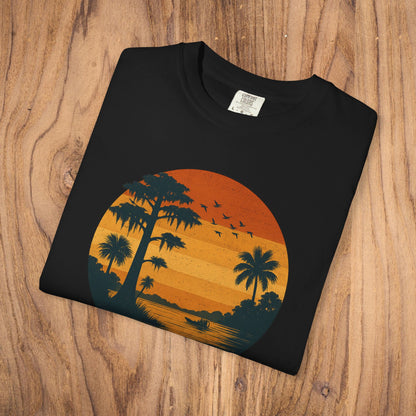 Unisex Garment-Dyed Sunset Tee - Soft 100% Cotton T-Shirt in black, featuring a striking sunset illustration with palm trees, suitable for comfortable casual style.