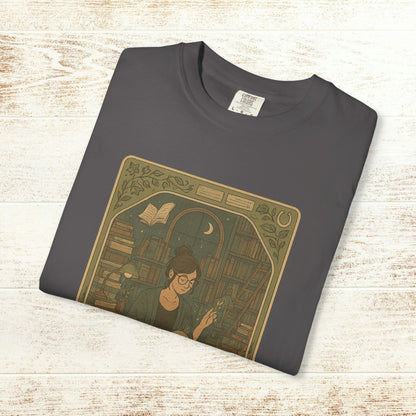 Page Turner Tarot Tee in charcoal color showcasing an enchanting design of a book lover, made from soft cotton, available in sizes S to 4XL, eco-friendly and comfortable.