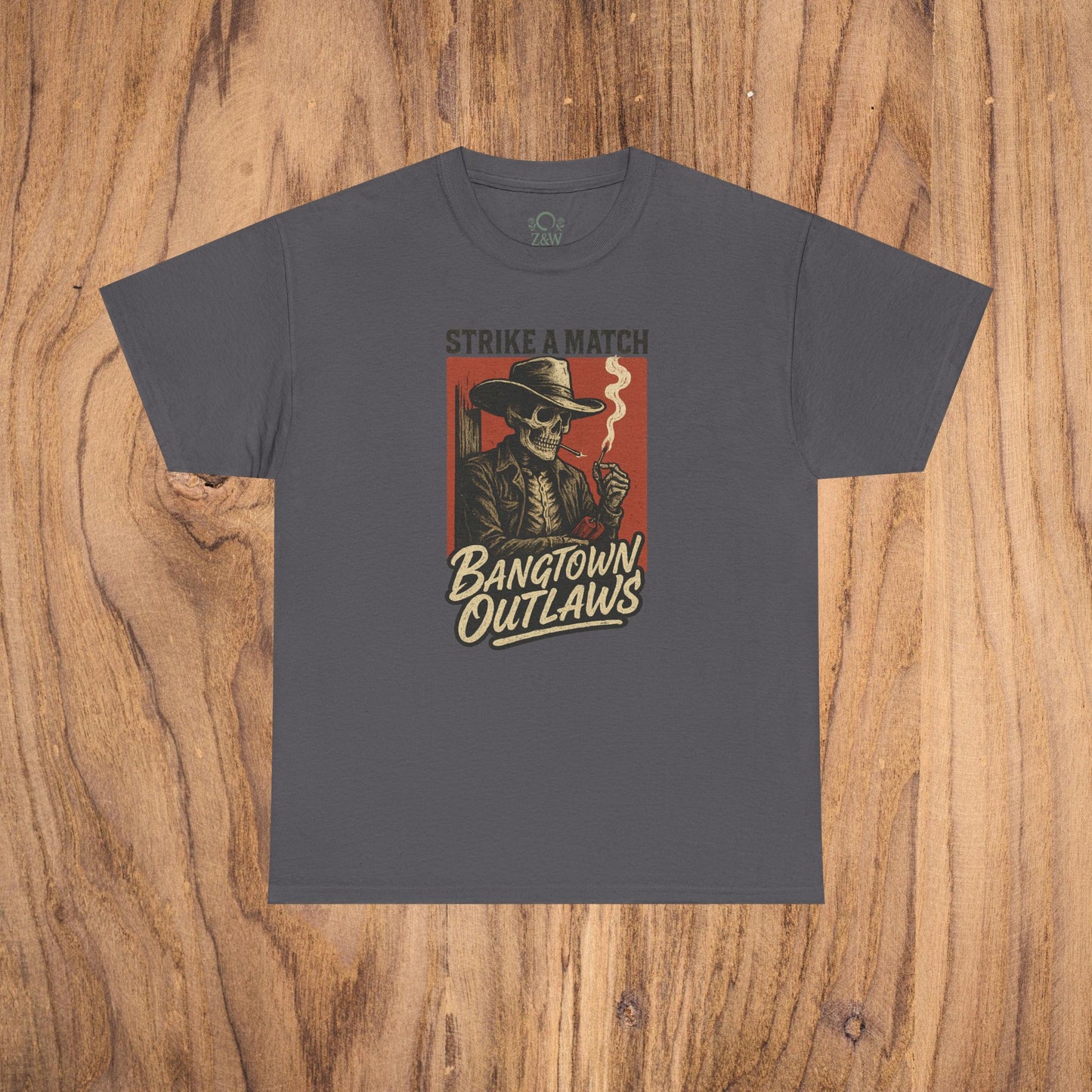 Bangtown Outlaws Retro Casual Party Shirt in charcoal gray color featuring a vintage skeleton character holding a cigarette and the tagline 'Strike a Match'. Perfect unisex cotton tee for stylish gifting and fun events.