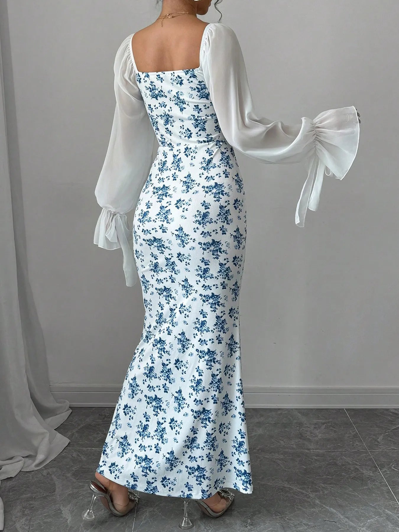 Floral Print Maxi Dress with Sweetheart Neckline and Ruffled Design, displaying the back view with a fitted bodice and flowy skirt.
