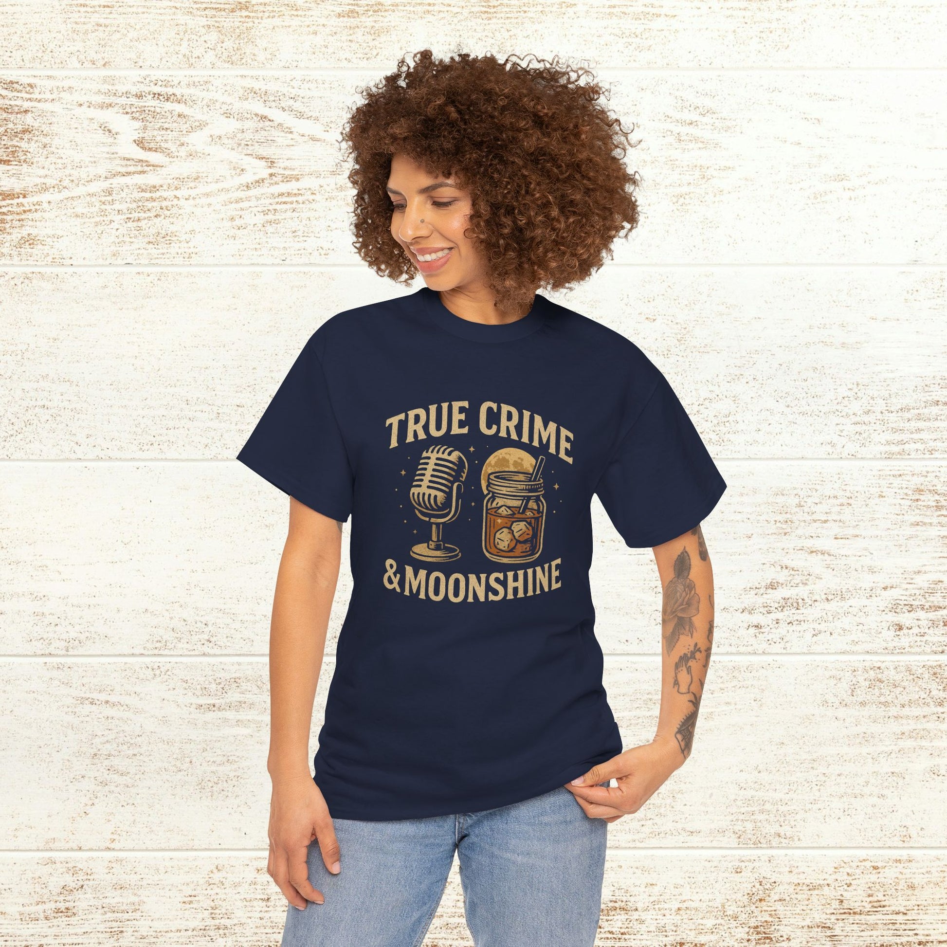 Model showcasing the navy True Crime & Moonshine Unisex Graphic Tee, featuring a unique graphic design, perfect for casual outings and true crime events.