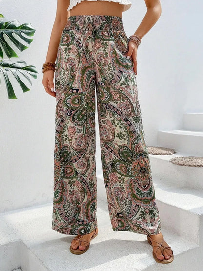 Trendy Printed Wide Leg Pants with Tied Detail, designed with elegant green and pink paisley patterns, complemented by a casual crop top for a fashionable, laid-back style.