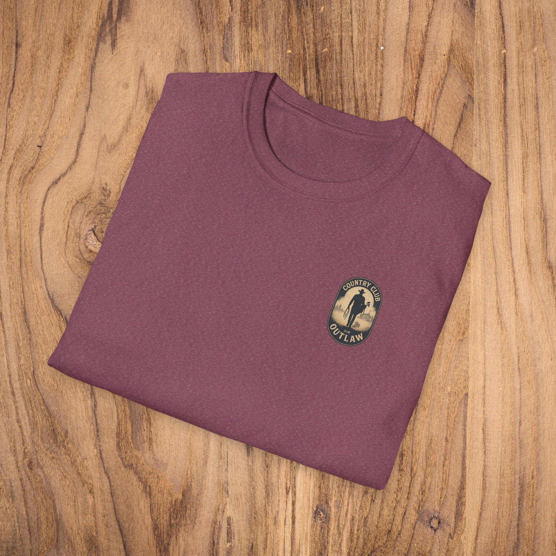 Folded Vintage Southern Gentleman Golf Shirt in maroon color displaying the Country Club Outlaw logo, crafted from soft 100% ring-spun cotton for a classic fit.