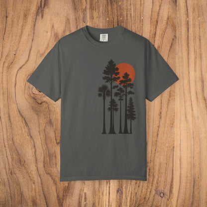 Sunset Trees Unisex T-Shirt in charcoal gray, featuring a beautiful silhouette of trees with a red sunset, made from 100% cotton for a stylish and comfortable everyday look.