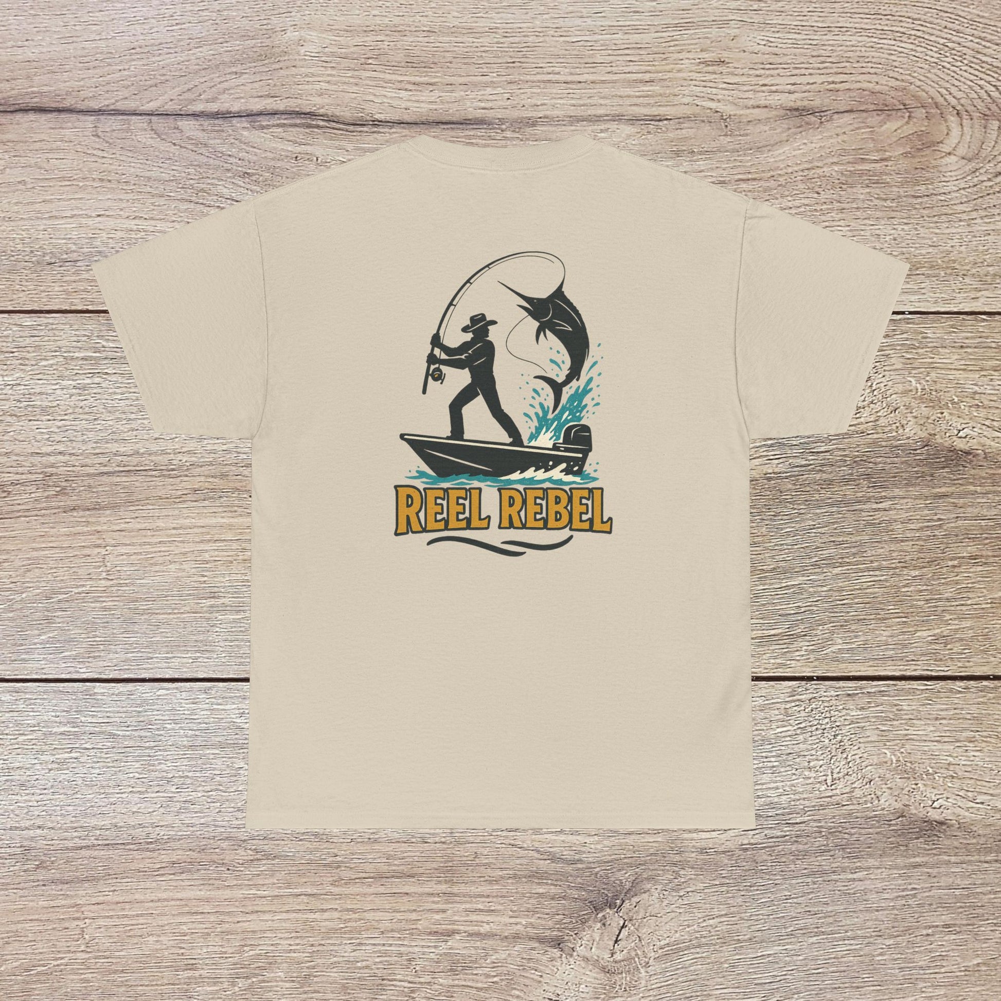 Fishing Adventure Tee in beige color showcasing 'REEL REBEL' graphic. Ideal unisex heavy cotton shirt gift for outdoor lovers and fishing trips.