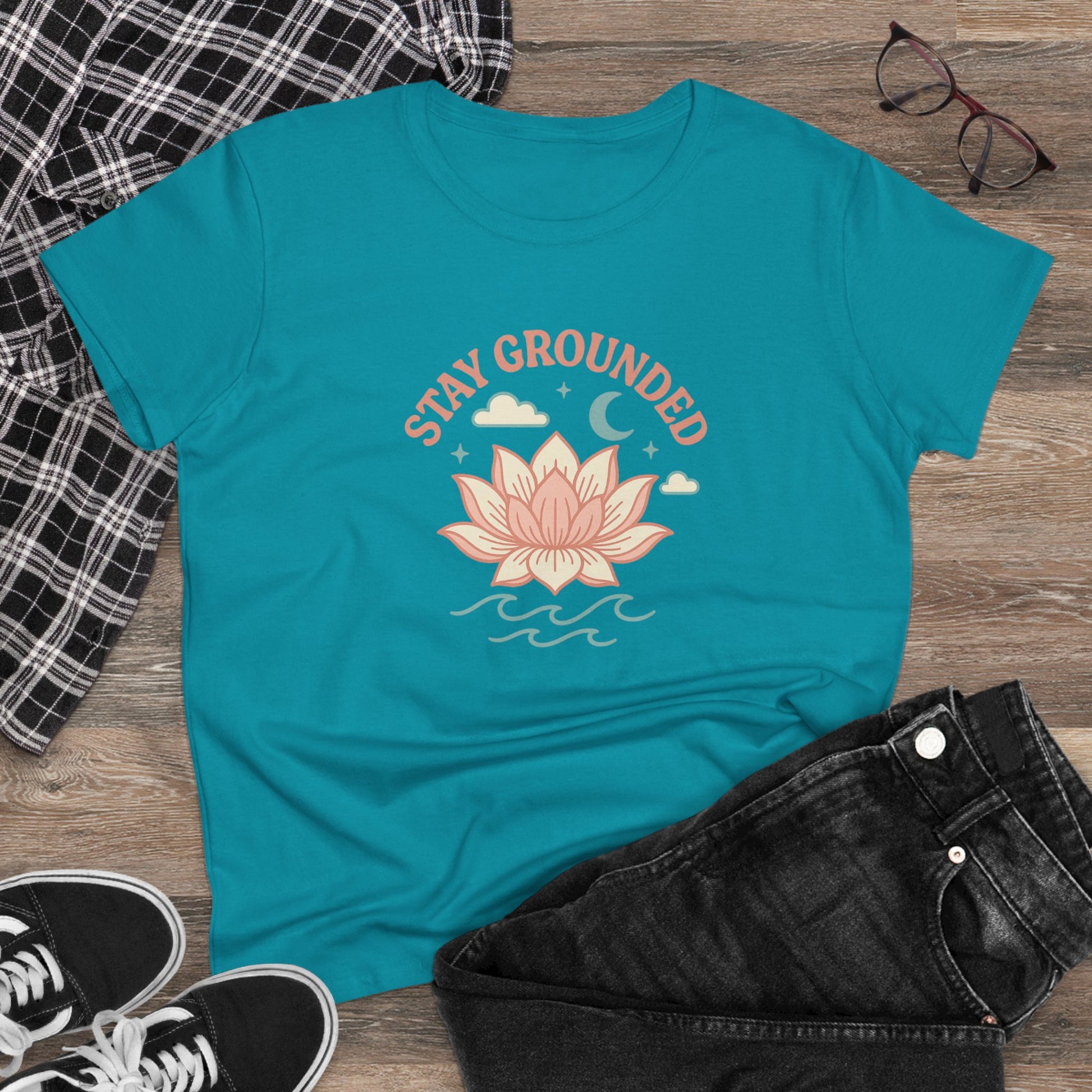 Stay Grounded Spiritual Tee featuring a beautiful lotus design on a vibrant turquoise crop top, perfect for festivals and casual outings.