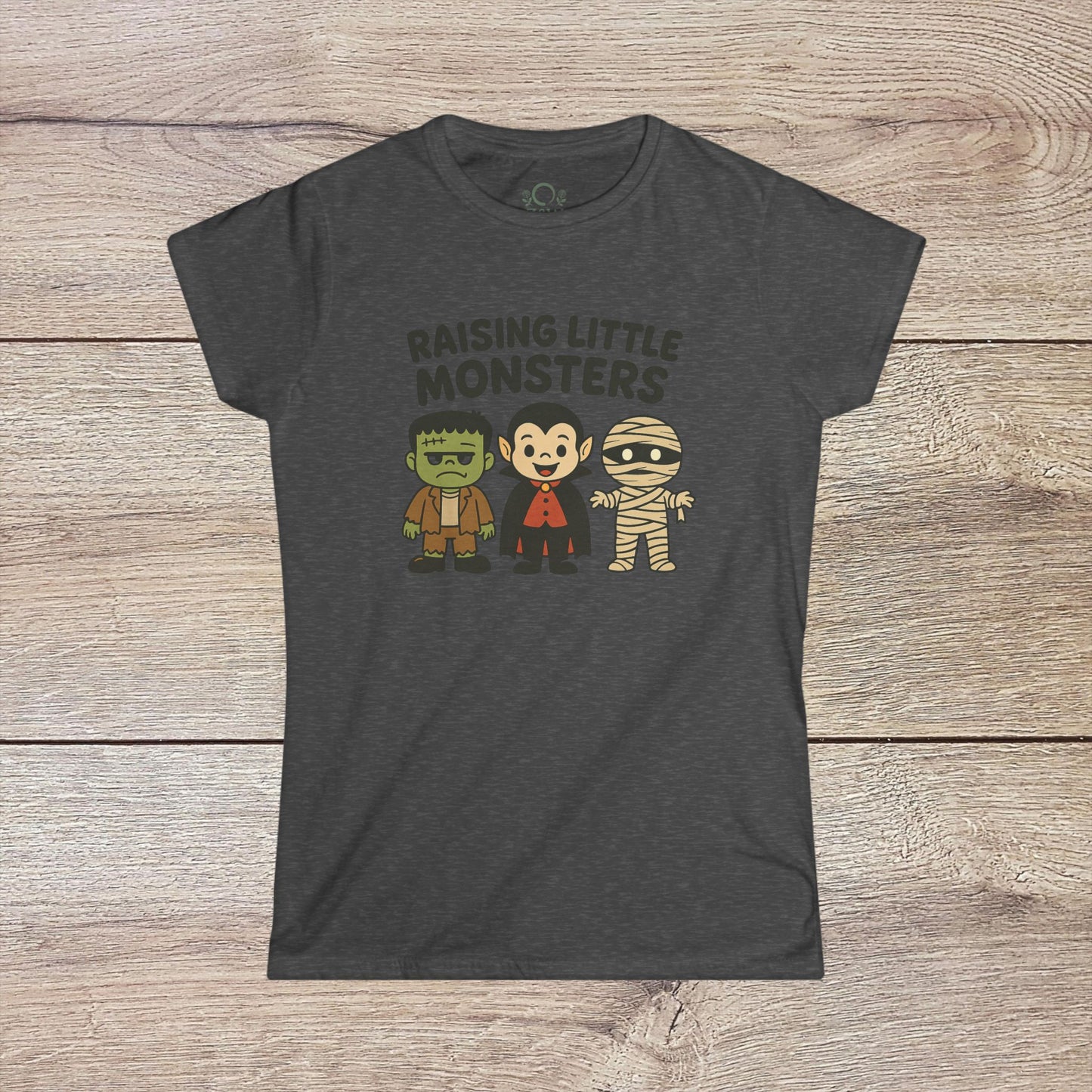 Halloween Family T-Shirt featuring cute cartoon characters of Frankenstein, a vampire, and a mummy, perfect for kids' parties and costumes - Raising Little Monsters Cute Kids Tee.