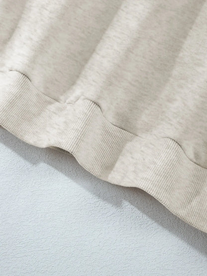 Close-up of the hem detail on the Trendsi Collared Sweatshirt - Soft Cotton Blend.