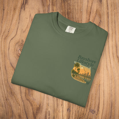 Bayshore Lifestyle Tee displayed flat on wood, showcasing the lightweight cotton fabric and ribbed neck, perfect for comfortable wear.