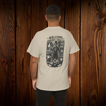 Back view of a Spooky Halloween Graphic Tee featuring a spooky design, ideal for Halloween celebrations, modeled by a man showcasing the shirt against a wooden background.