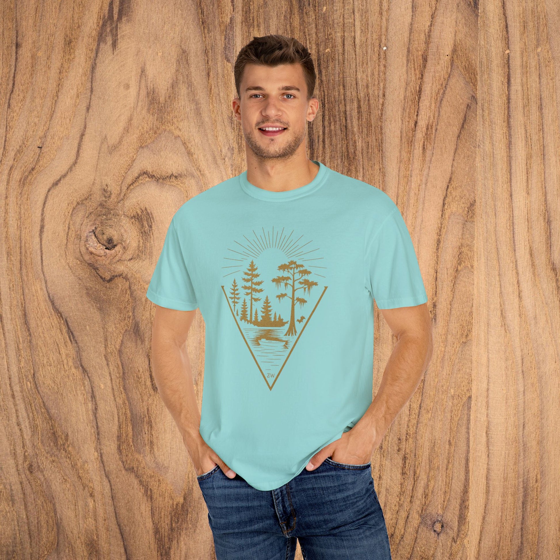 Man modeling the Nature Outdoor Vibes Tee in light blue, designed with a nature theme, ideal for casual outdoor wear.