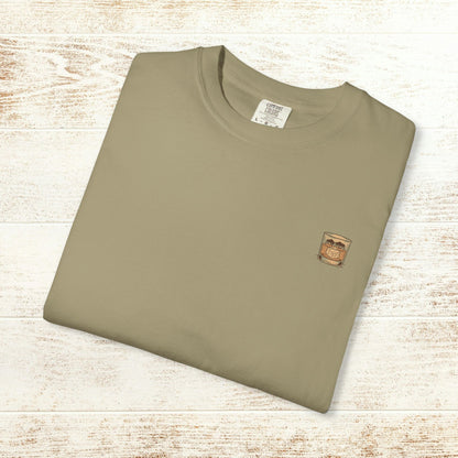 Rodeo On The Rocks Tee displayed flat, showcasing the unique garment-dyed style and soft 100% US cotton fabric, perfect for casual wear.