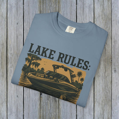 Front view of the Unisex Garment-Dyed Lake Rules Tee in blue, featuring a graphic of a boat and the words 'Lake Rules' for lake lovers.