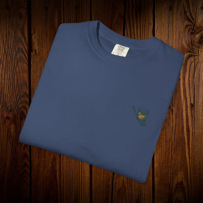 Men's Golf & Whiskey Tee presented in a rich blue color, featuring a small whiskey glass design, combining comfort with an eco-friendly style.