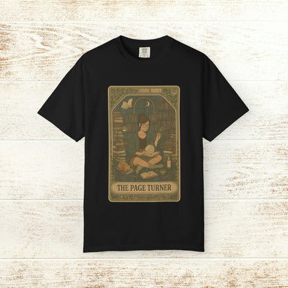 Page Turner Tarot Tee in black, presenting a creative illustration of a book enthusiast in a library, made from comfortable, ethically produced cotton, available in sizes S to 4XL.