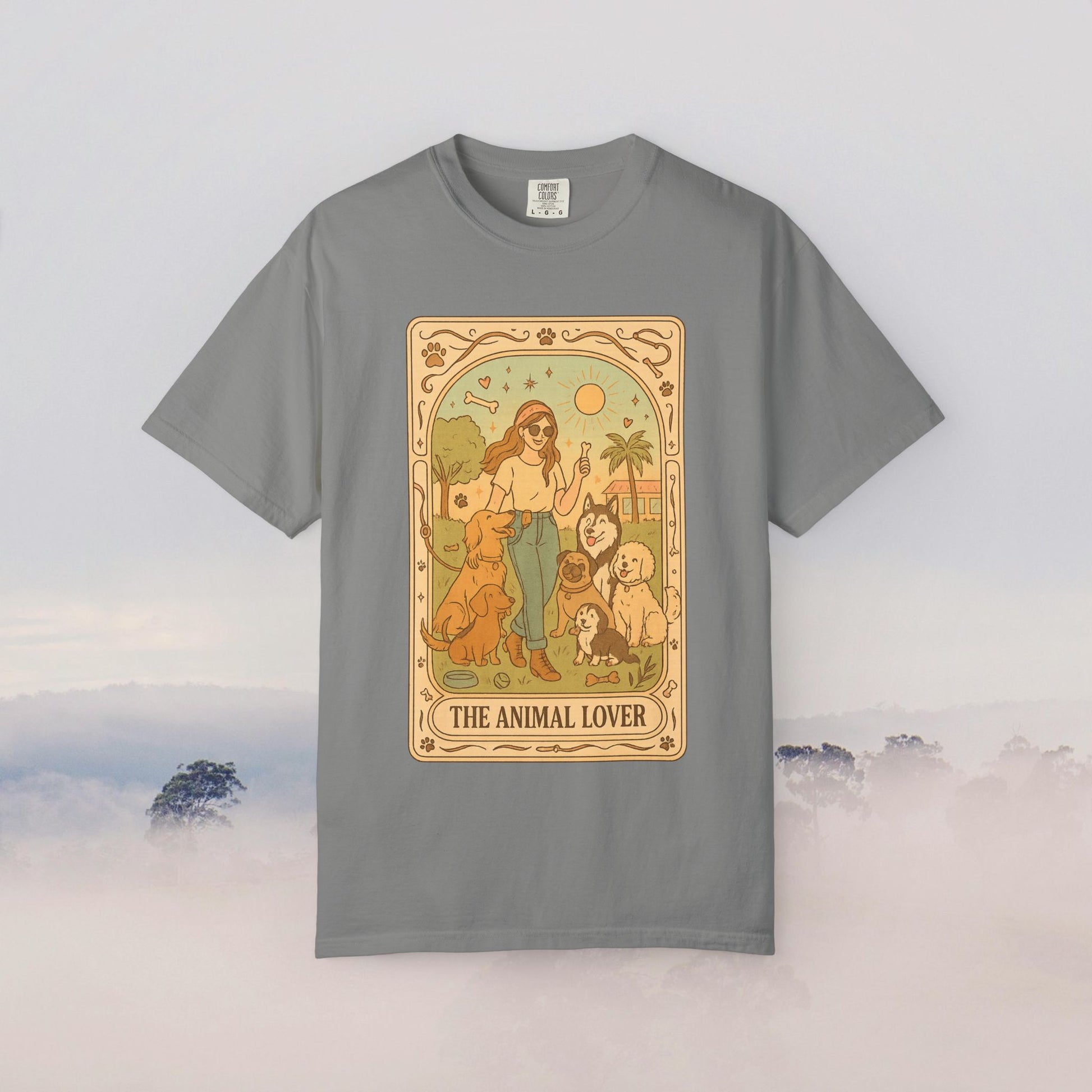 Animal Lover Tarot Tee in stylish gray featuring a unique illustration of a woman with various animals, a must-have for any animal lover's wardrobe.