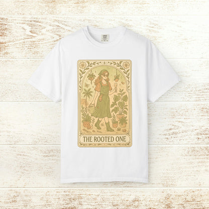 Rooted One Tarot Tee in white, adorned with an artistic depiction of a figure amidst plants. Ideal for those who appreciate unique, ethically made clothing.