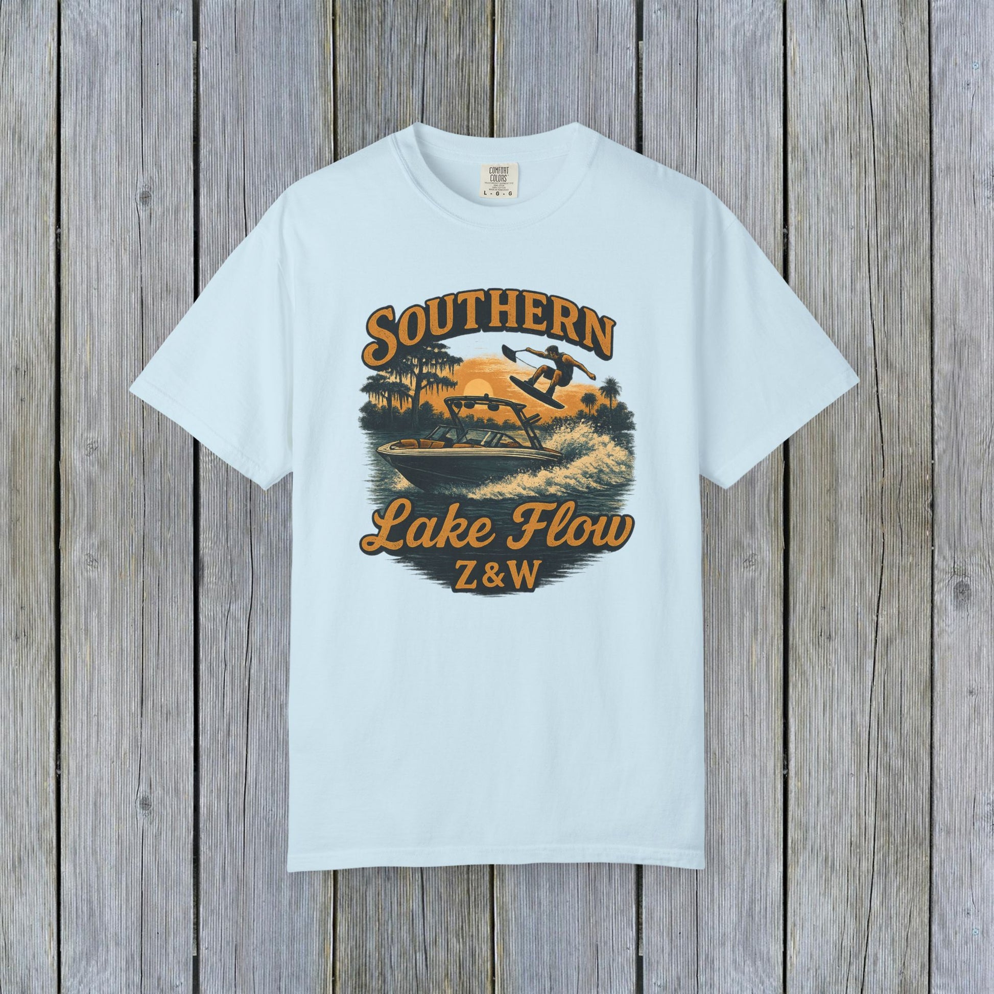 Southern Lake Flow T-Shirt in soft mint color, displaying a nostalgic design of a wakeboarder enjoying a lake, an ideal choice for lake lovers and eco-friendly fashion.