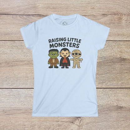 Light blue Halloween Family T-Shirt with adorable illustrations of Frankenstein, a vampire, and a mummy, ideal for festive events - Raising Little Monsters Cute Kids Tee.