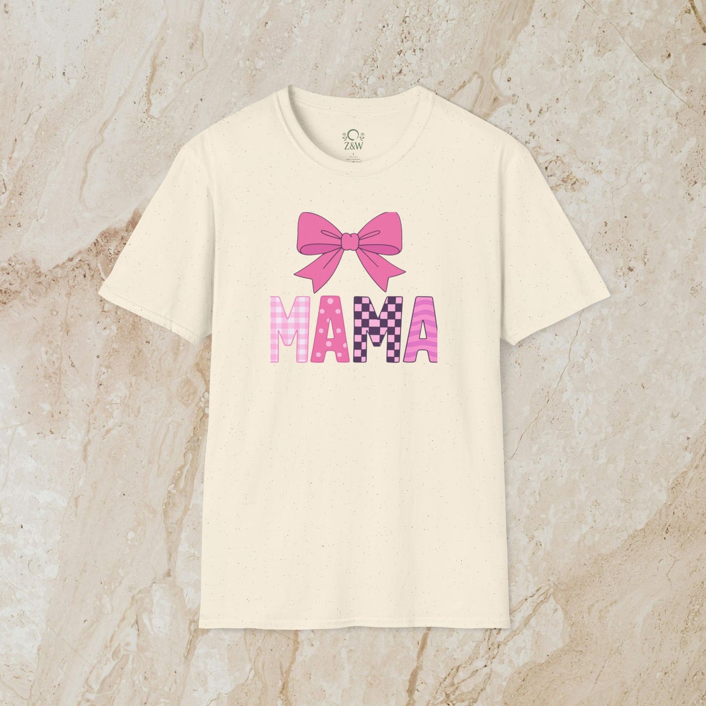 Cream Mama Bow Tee designed with a pink bow graphic, showcasing the seamless 100% cotton fabric and ribbed collar.