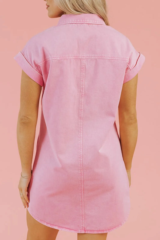 Back view of a Button Down Short Sleeve Denim Dress with Pockets in pink, made of 100% cotton, showcasing a classic fit and easy care.