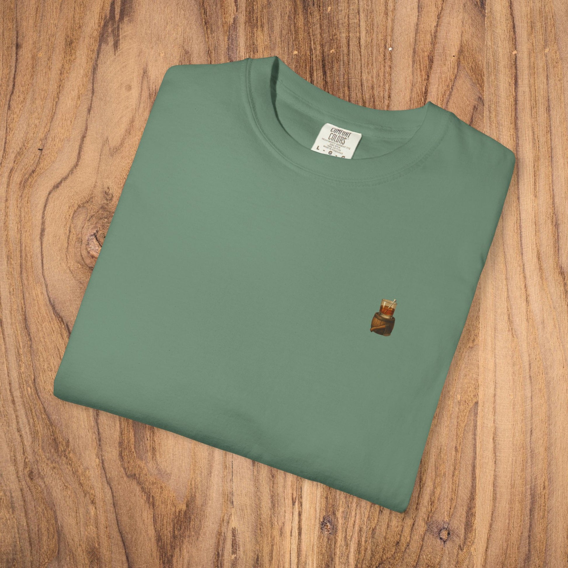 Folded Premium Southern Made T-Shirt in a soothing green color, highlighting the stylish logo, perfect for layering in casual outfits.
