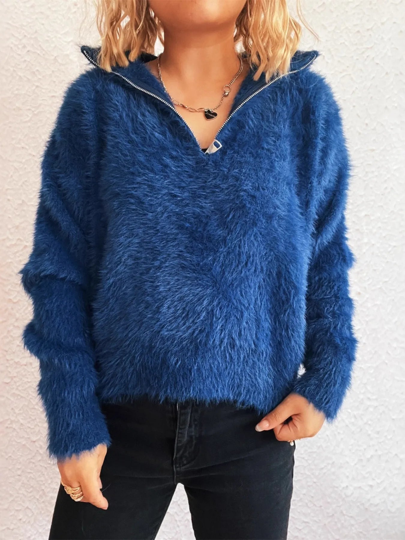Side view of the blue Cozy Fuzzy Half-Zip Sweater for Women, emphasizing its relaxed fit and comfortable style, ideal for casual wear.