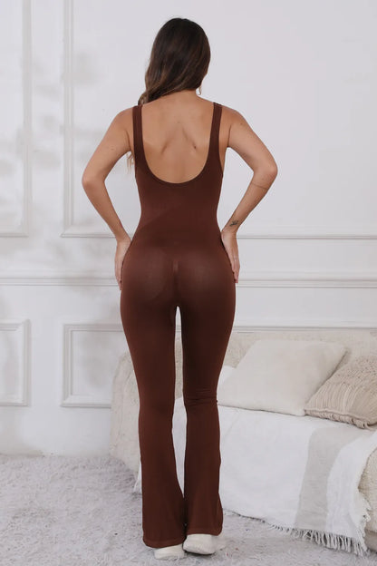 Scoop Neck Wide Strap Active Jumpsuit with Moderate Stretch - Comfortable & Stylish Fitness Wear. Rear view of the model in a brown jumpsuit, highlighting the flattering fit and stylish design.