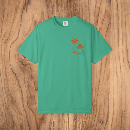 Unisex Sunset Palm Tree T-Shirt in bright green - vibrant garment-dyed cotton tee for men and women, an essential for beach trips.