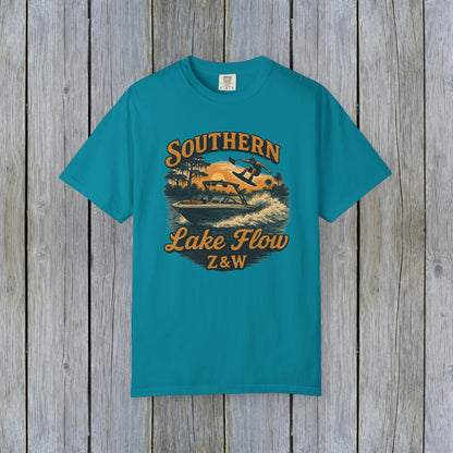 Southern Lake Flow T-Shirt in vibrant turquoise color, featuring a stylish graphic of a wakeboarder on a lake with a vintage design, perfect for eco-conscious fashion enthusiasts.