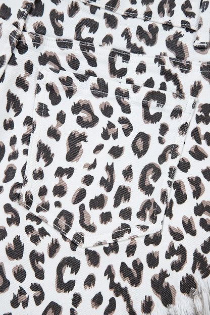 Back pocket detail of Leopard Frayed Hem Denim Shorts - Accent on leopard print and functional design.