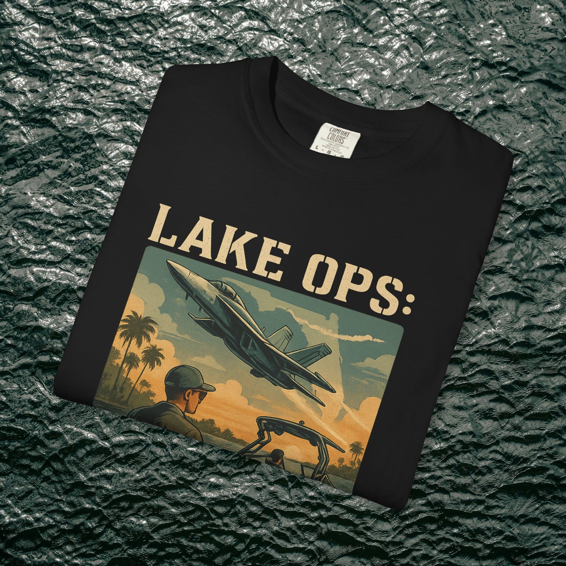Garment-Dyed Comfort Tee For Adults in black color showcasing a vibrant 'LAKE OPS:' graphic, ideal for outdoor adventures or relaxing days at home. Made from 100% ring-spun cotton, sizes S-4XL available.