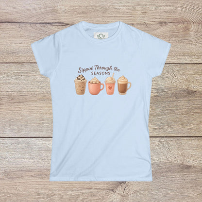 Sippin' Through The Seasons Slim Fit Tee in soft blue, featuring printed seasonal drink designs, made of 100% combed cotton with a comfortable fit.