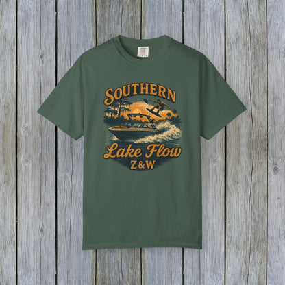 Southern Lake Flow T-Shirt in dark green, featuring a colorful graphic of an adventurous water skier, made with eco-friendly 100% US cotton, available in sizes S to 4XL.