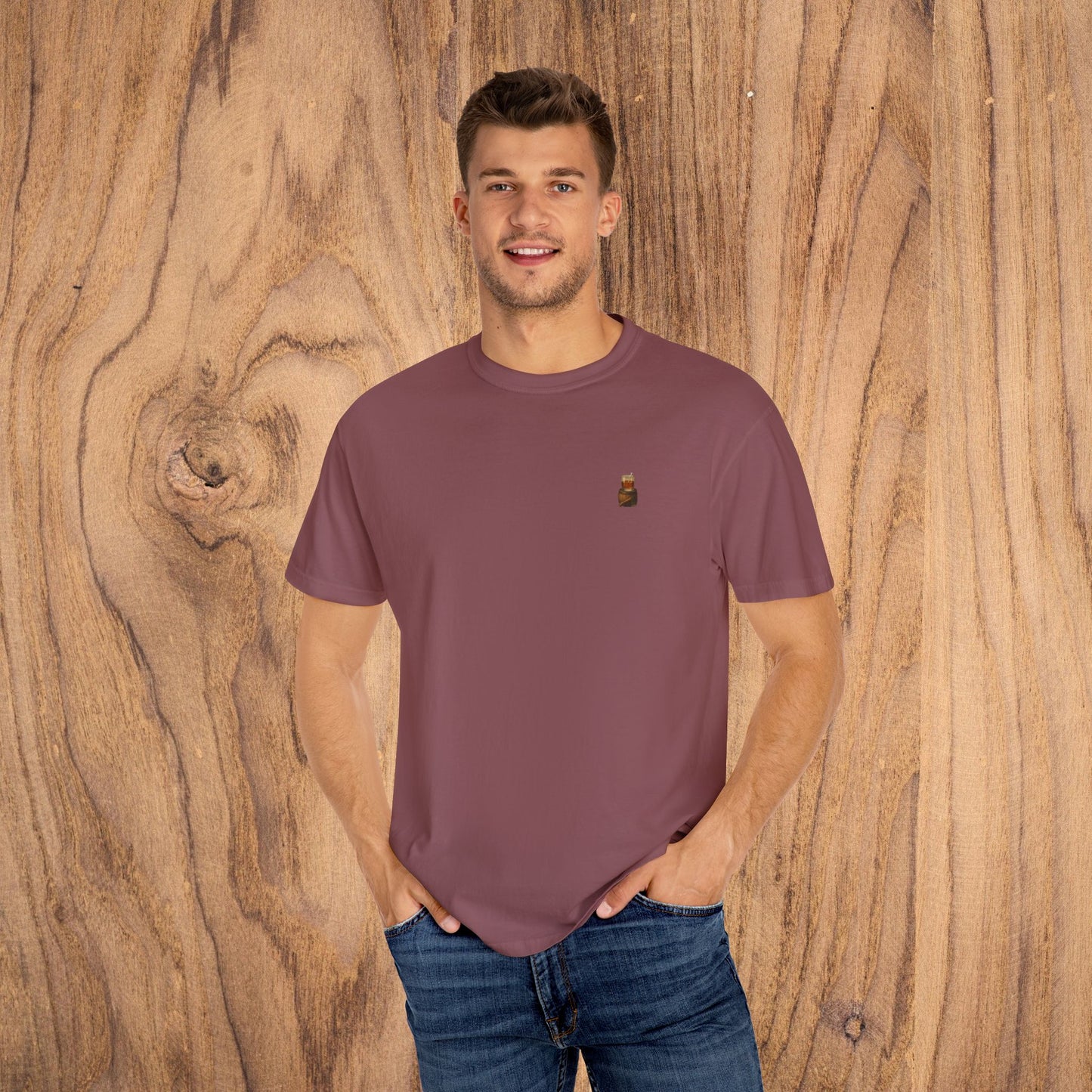 A model displaying a maroon Premium Southern Made T-Shirt, emphasizing stylish casual wear with a confident pose.
