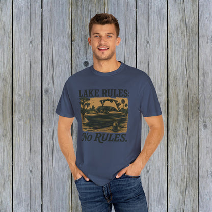 Unisex Garment-Dyed Lake Rules Tee - Soft Vintage Fabric, Sizes S to 4XL, perfect for outdoors, modeled by a male against a wooden background, promoting relaxed outdoor style.